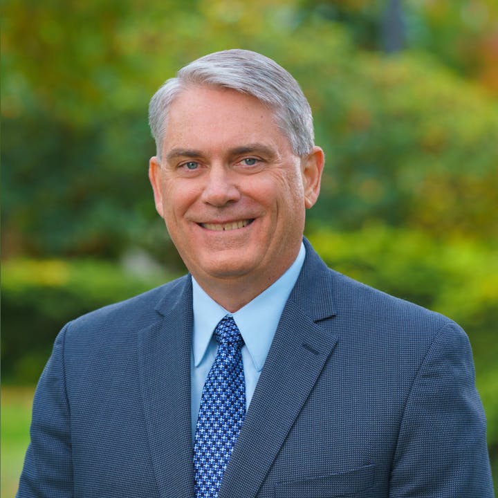 male in suitjacket headshot, happy